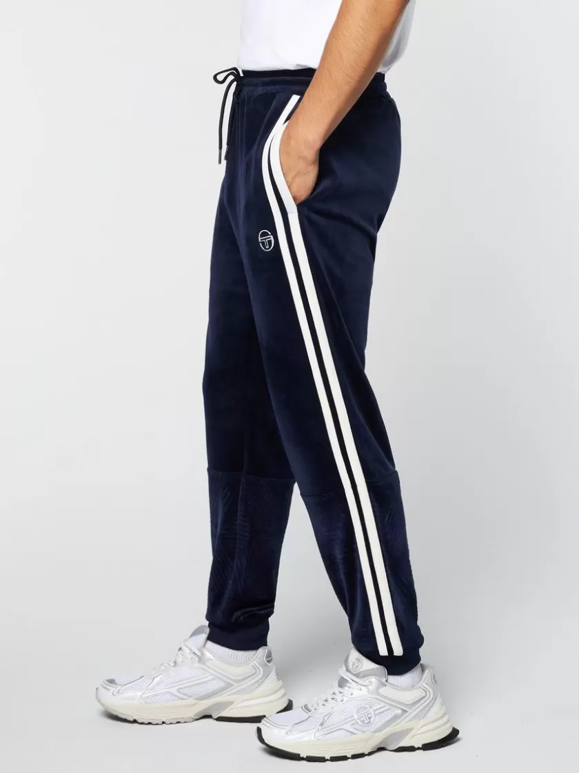 Shop Debossed Damarindo Velour Track Pant- Maritime Blue Pants And Sweatpants